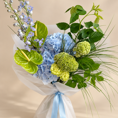 Blue Hydrangeas, Delphiniums, Anthuriums and Green Viburnum